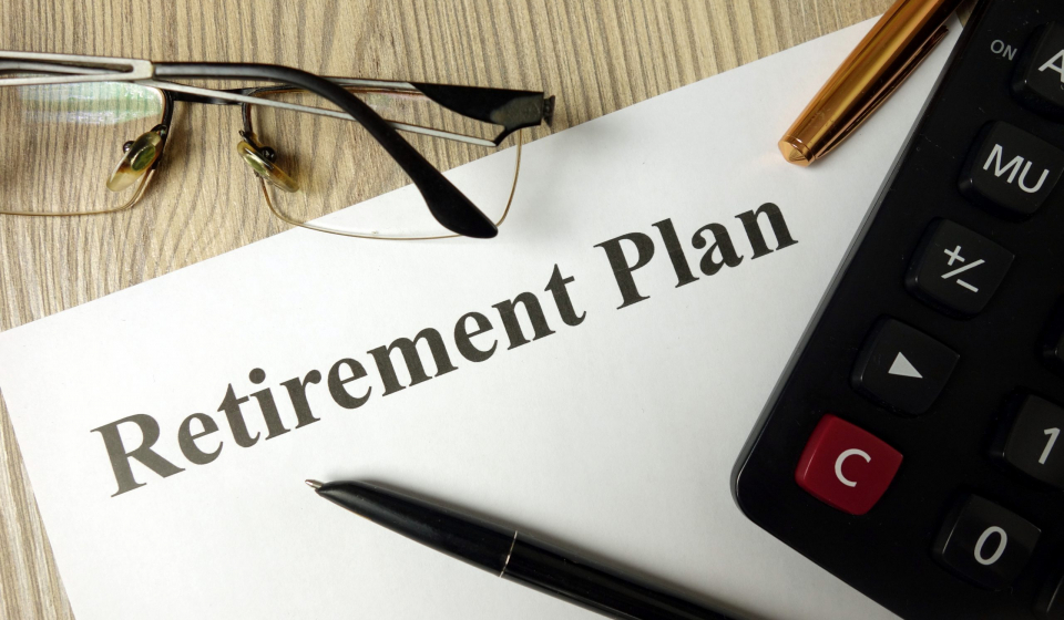 Retirement plan with calculator pen and glasses, personal finance planning