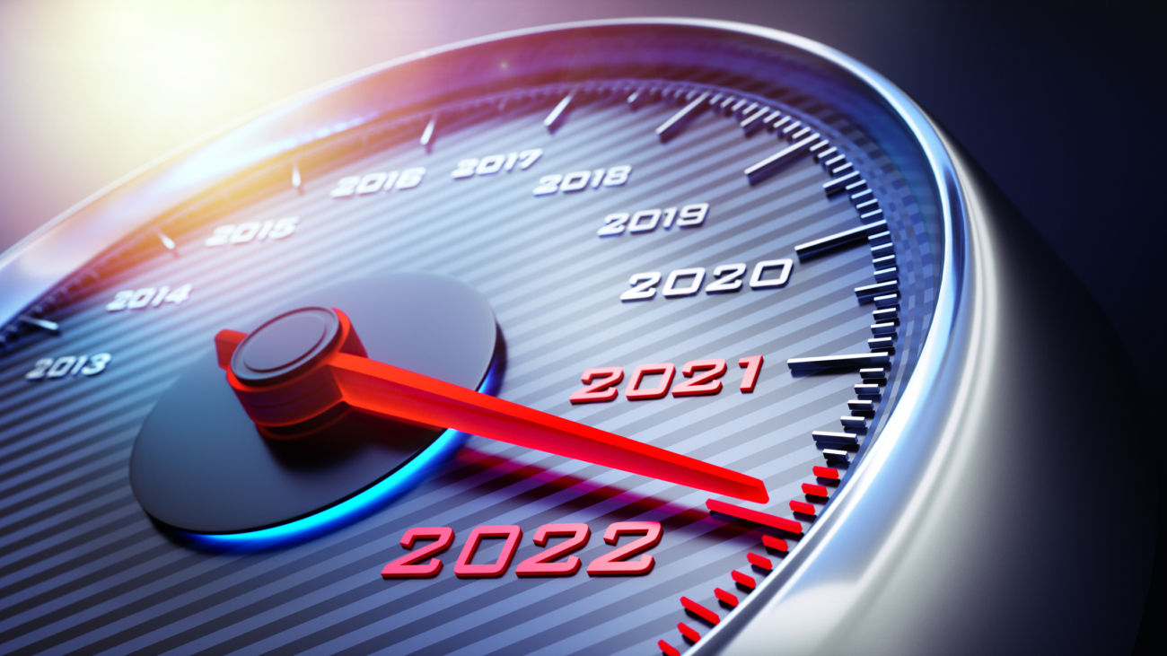 Dark stylish speedometer with needle moving to the year 2022
