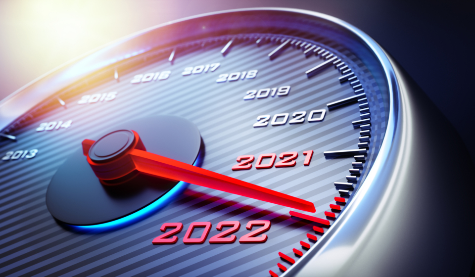 Dark stylish speedometer with needle moving to the year 2022